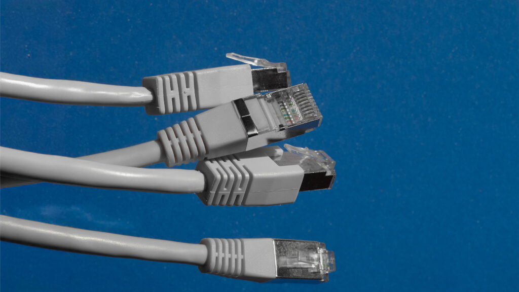 Grey cords on a blue background.