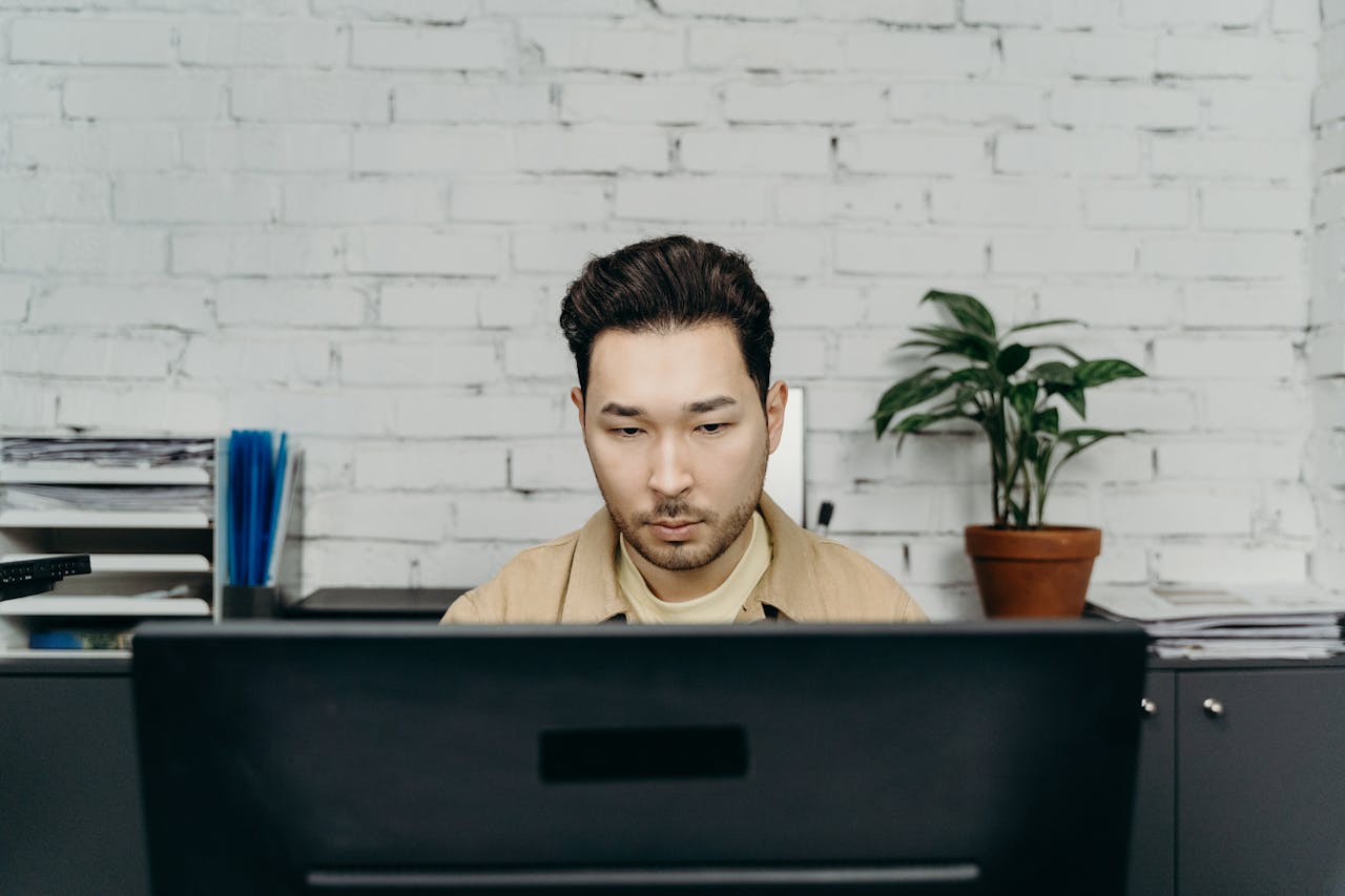 Man working at a desk.