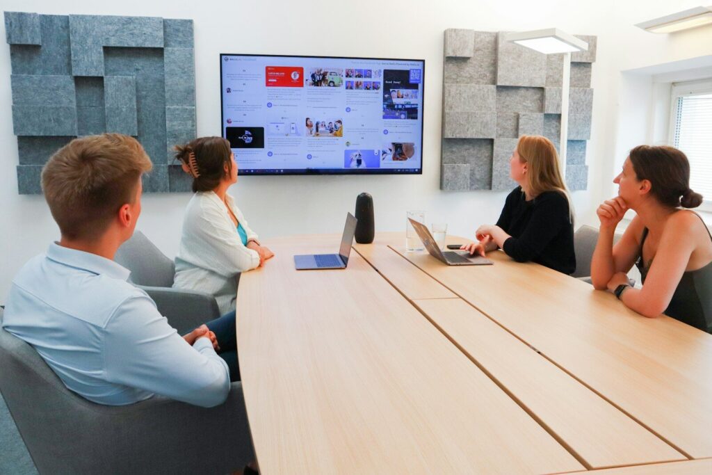 Commercial Cabling 1 a group of people sitting around a conference table